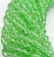 ББ020НН4 Хрустальные бусины "биконус", цвет: св-зеленый прозрачный, размер 4 мм, кол-во: 95-100 шт. фото 2