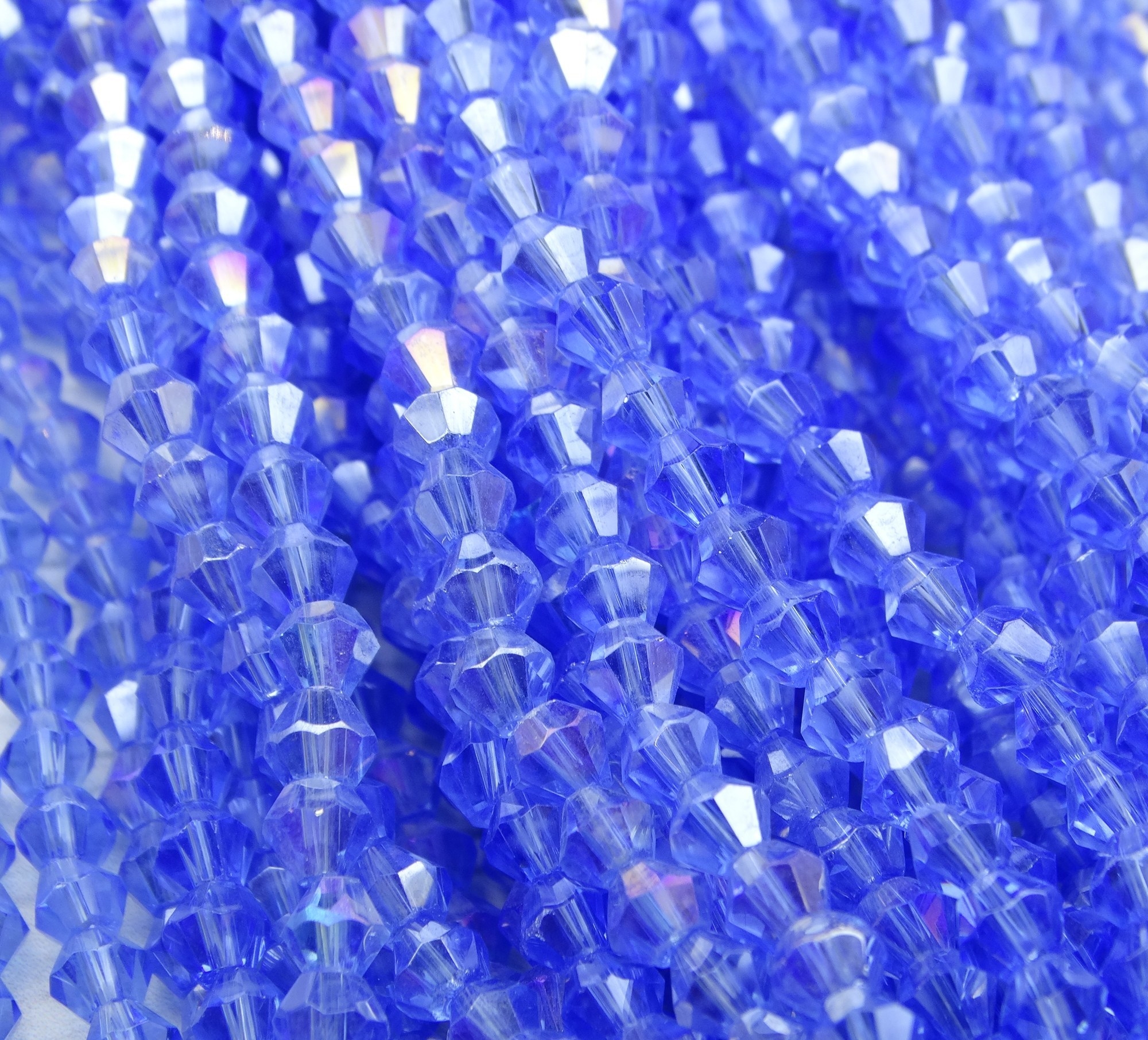 ББ017ДС4 Хрустальные бусины "биконус", цвет: св-голубой AB прозр., размер 4 мм, кол-во: 95-100 шт.